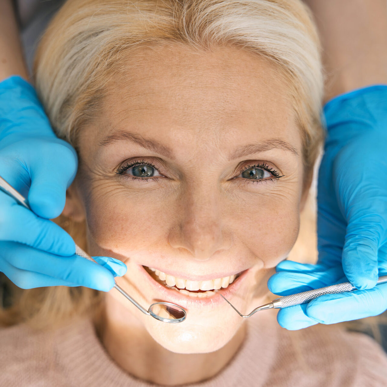 Smiling Woman Visiting Dental Cabinet For Procedure Smiling Woman Visiting Dental Cabinet For Procedure